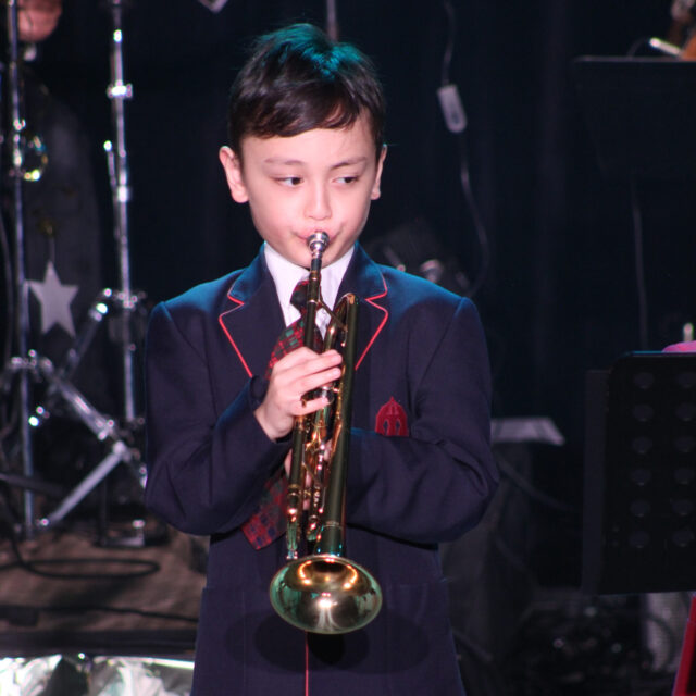 Junior school jazz player at music showcase